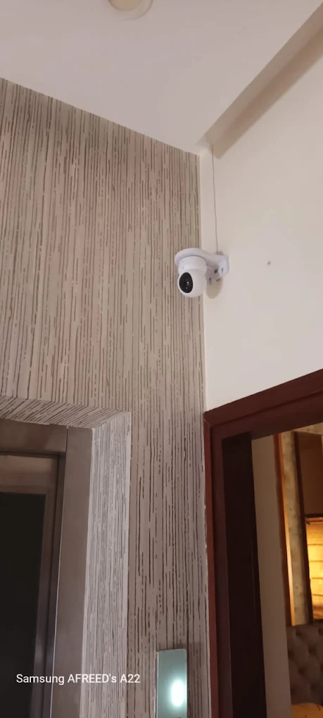 Dome CCTV camera mounted high on an interior wall