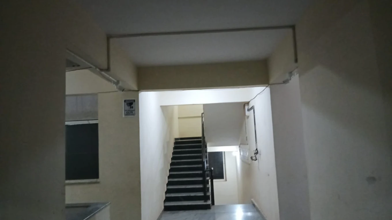 CCTV cable routed along an interior stairwell